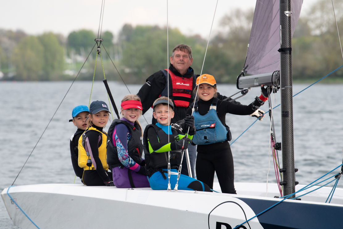 An image of Young Sailors sailing on the boat with a guide at the ET 2023