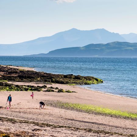 family walking along beach