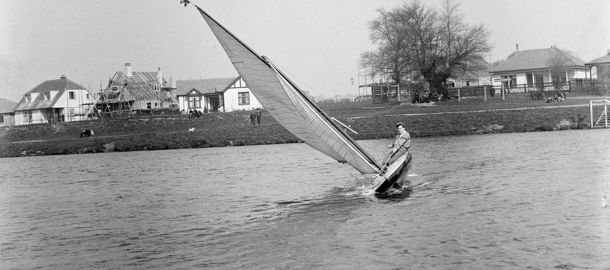 Black and white image of a dinghy sailor 