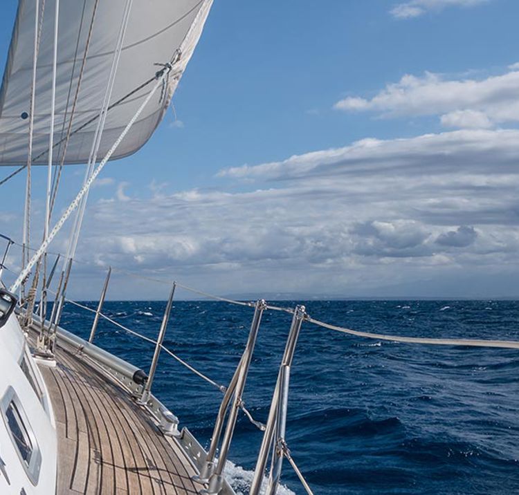 Boat sailing through calm blue waters