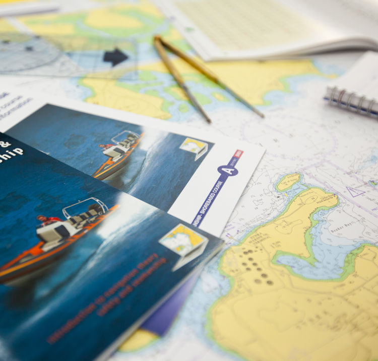 Training resources, books and charts laid out on a desk