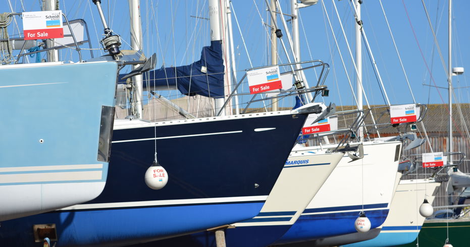 Lots of yachts for sale all in a line on the shore