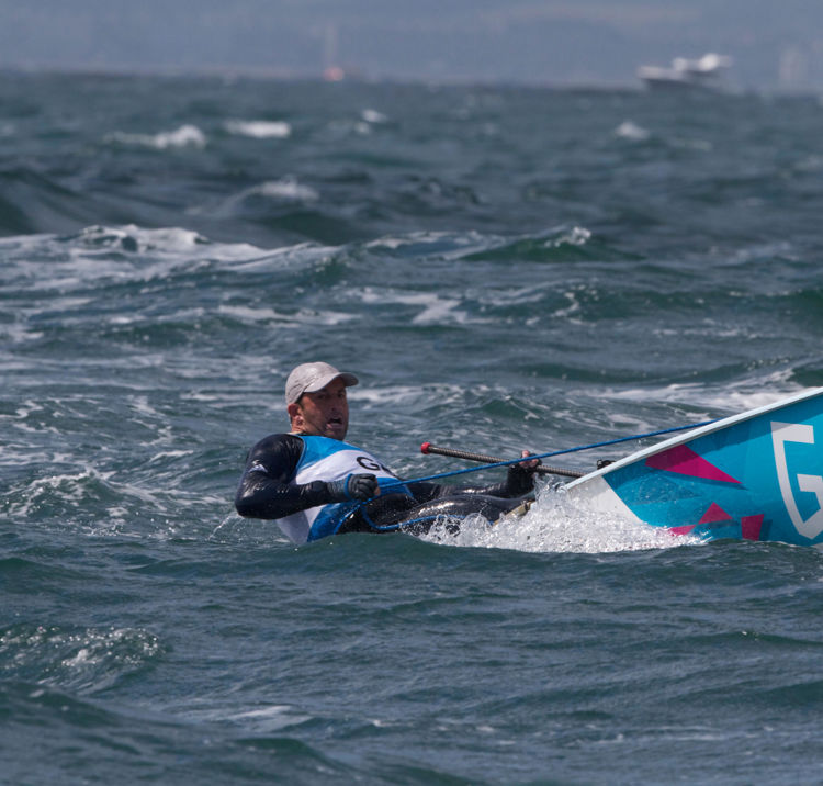 Dinghy sailor travelling through the water