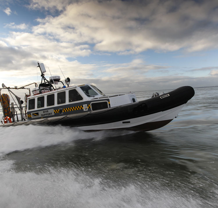 commercial rib charter travelling speedily through the water