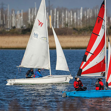 Two dinghies sailing side by side