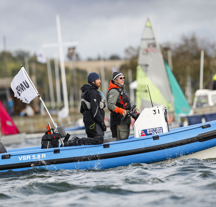 two race officials on a powerboat
