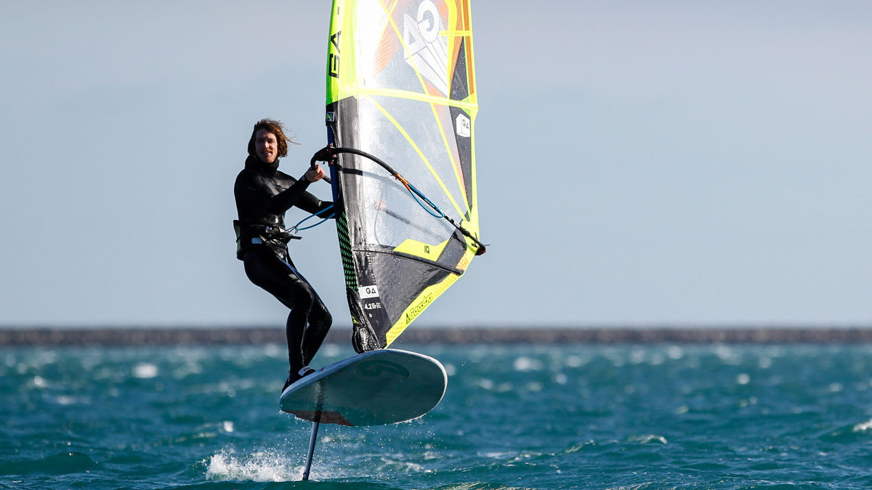 Man stood on windsurfing board