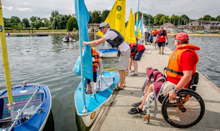 sailability sailing session, sailor in wheelchair approaching boat