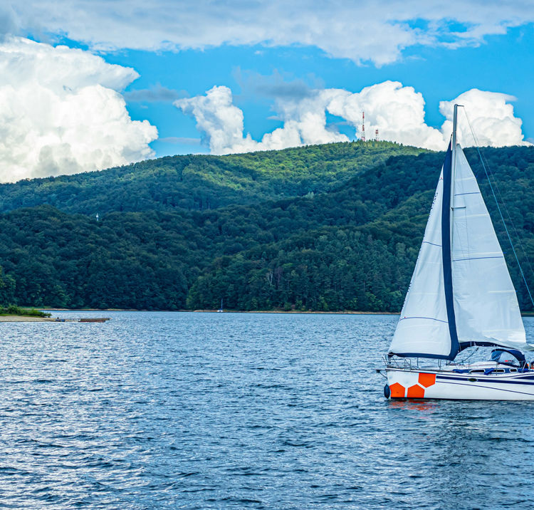 boat surrounded by rolling hills