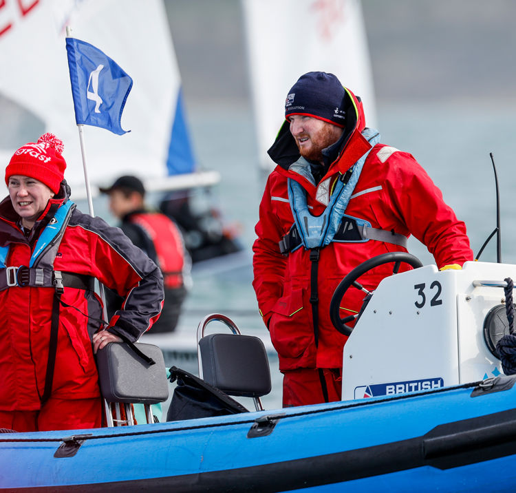 Two sailors on a Rib looking out at the water