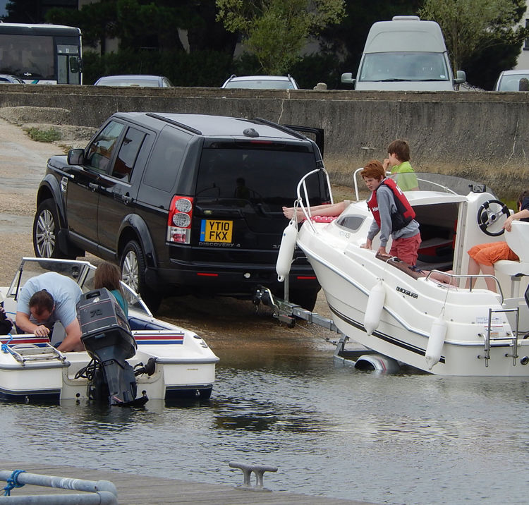 Boats being removed from water using slipway