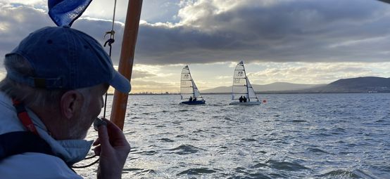 Race Officer looks out at fleet of RS400s in Belfast Lough