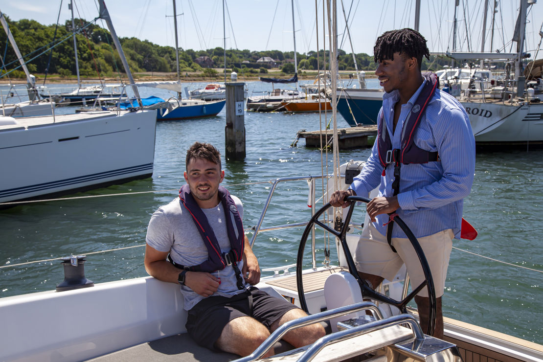 Two men on a boat in sunny weather