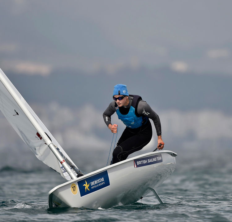 man sailing a single handed dinghy 