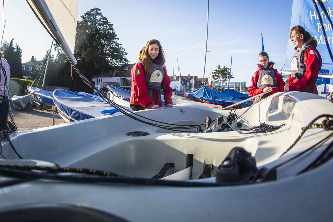members stood near their boat