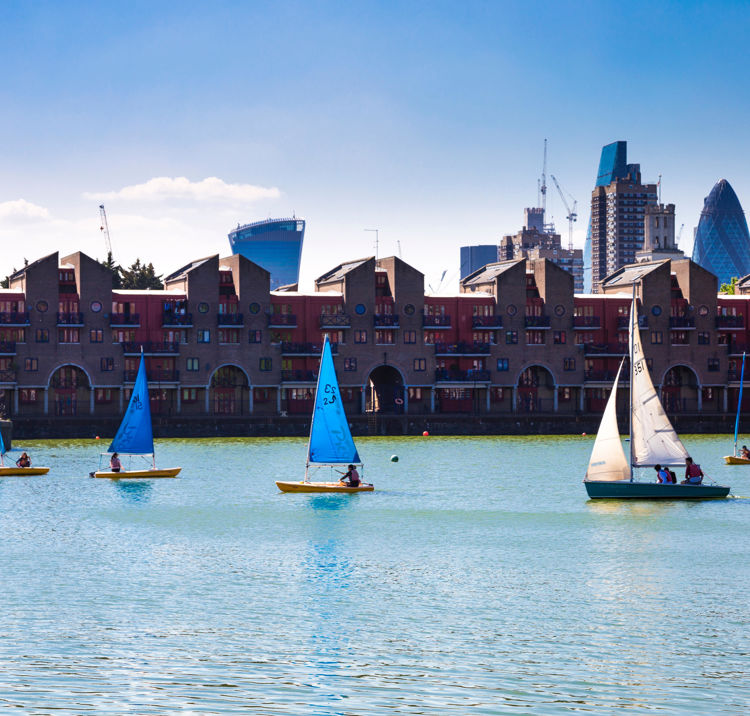 Dinghies sailing in city club