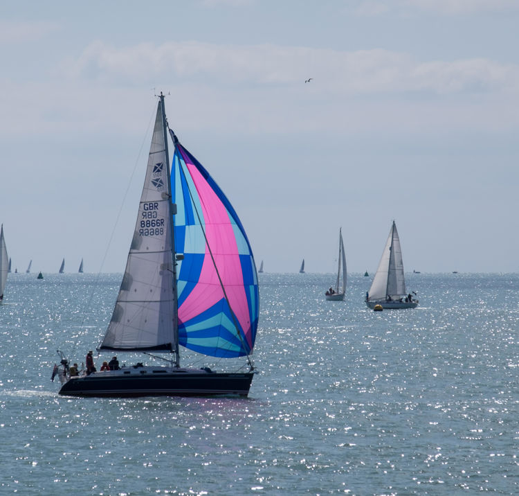 boats sailing across sparkling waters