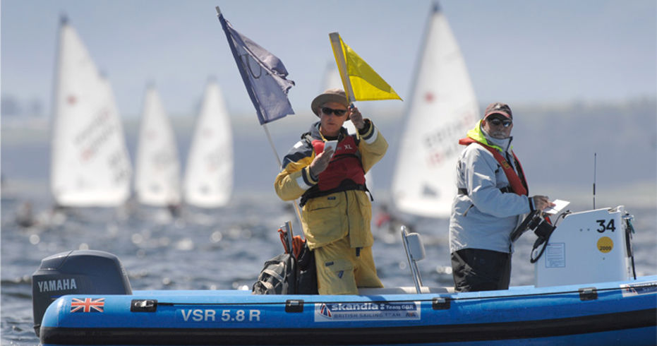 	2 race officials officiating a race..