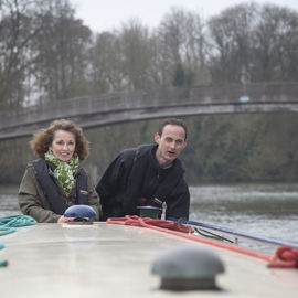 couple enjoying a winters day on their canal boat