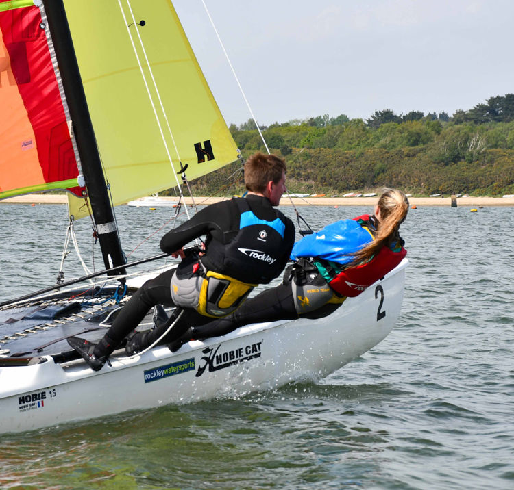 Mid shot of man and woman on double handed dinghy