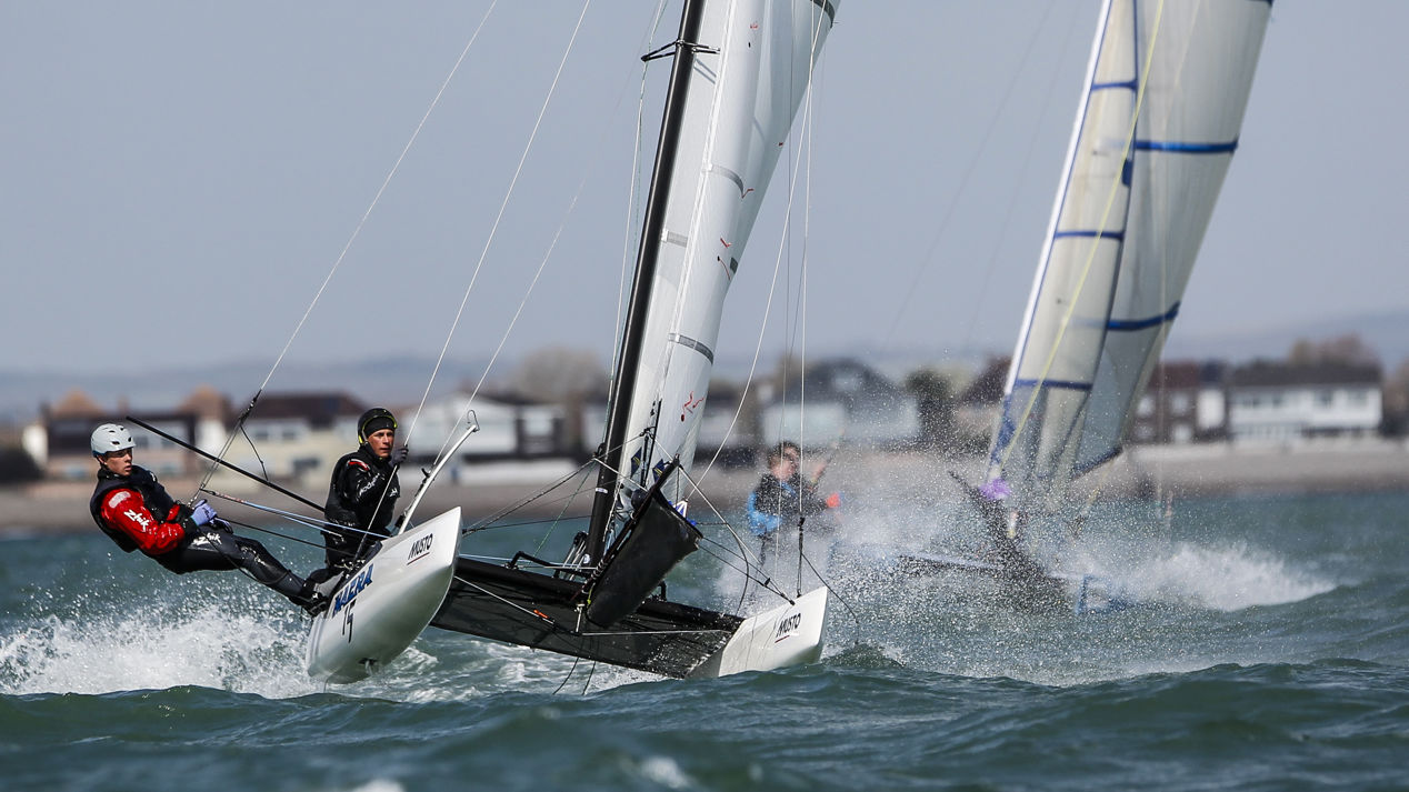 Watersports enthusiasts cutting through the waves