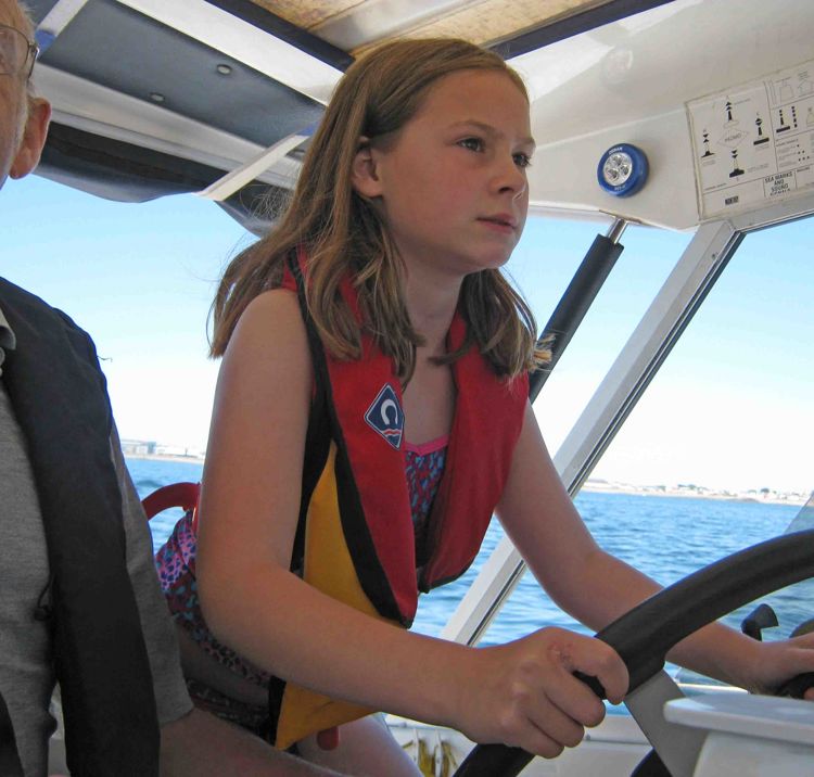 Instructor Norman Crabb, with Issy At The Helm