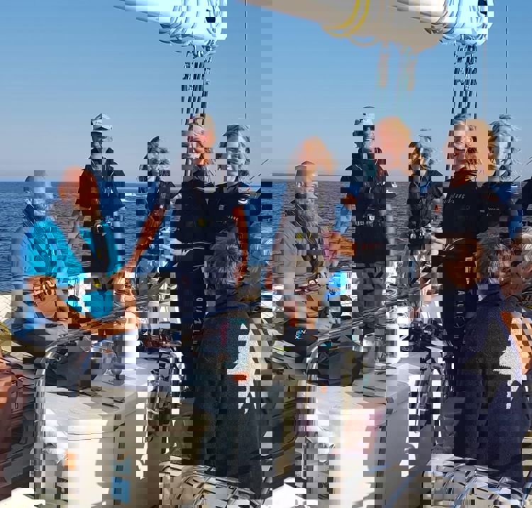 Group of volunteers and sailors on a yacht
