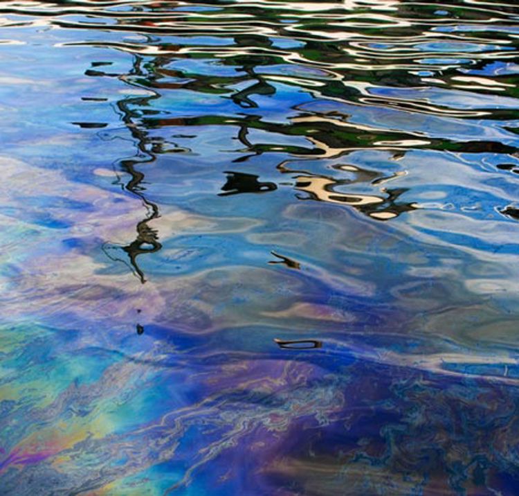 Oil and fuel leakage on the water