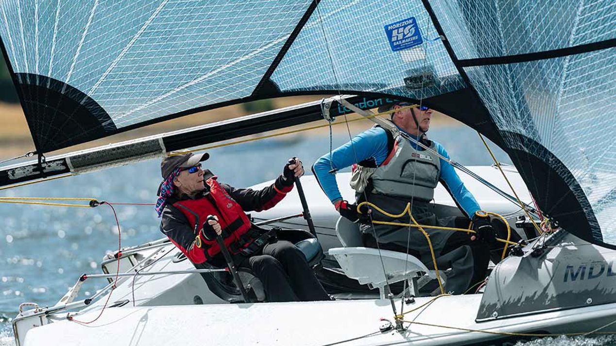 Two people in a parasailing boat