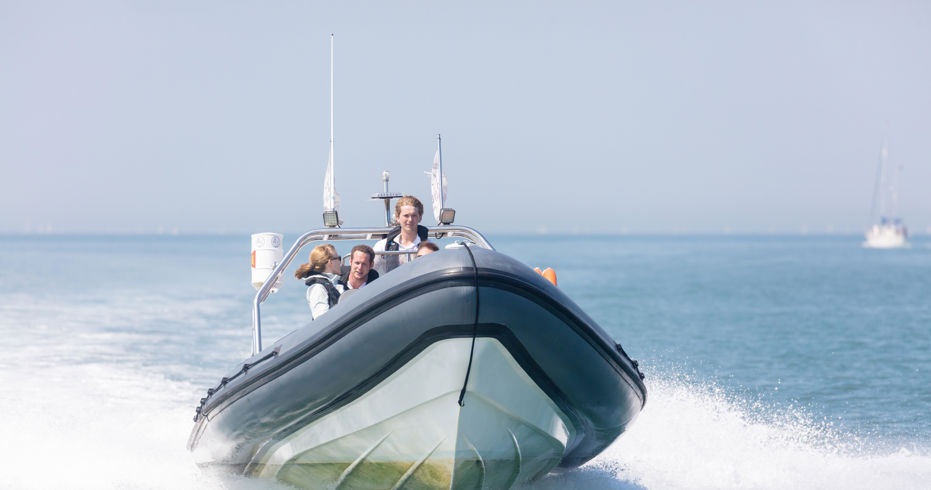 group of people riding a powerboat safely