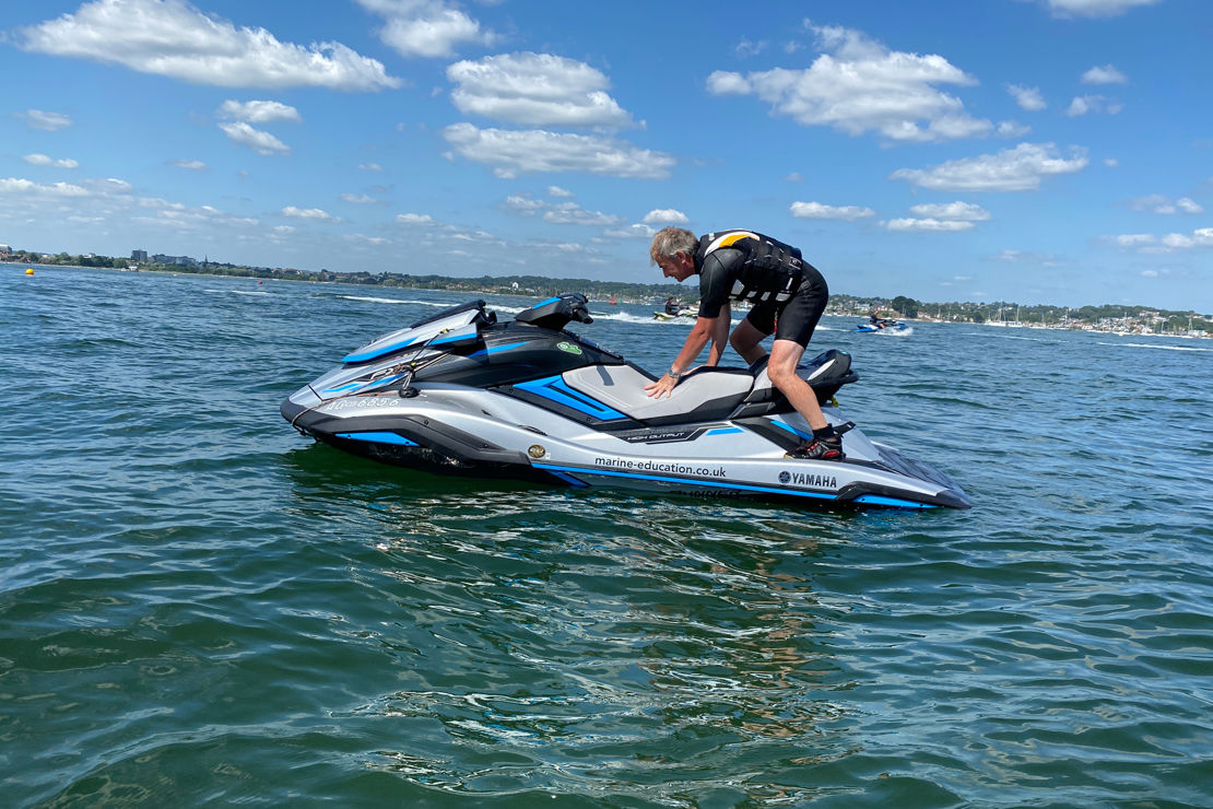 Long shot of man on his personal watercraft