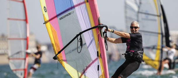 older gentleman windsurfing