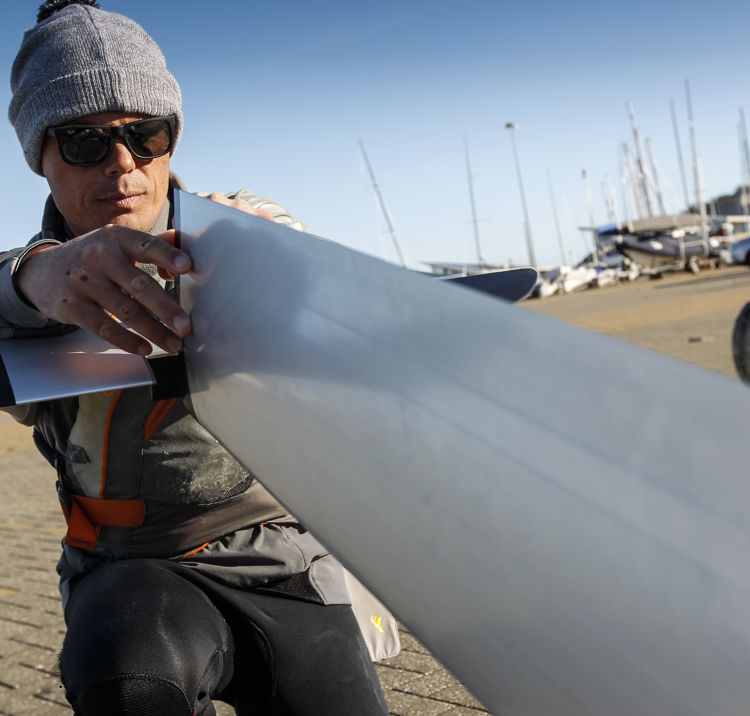Sailor adjusting their boat