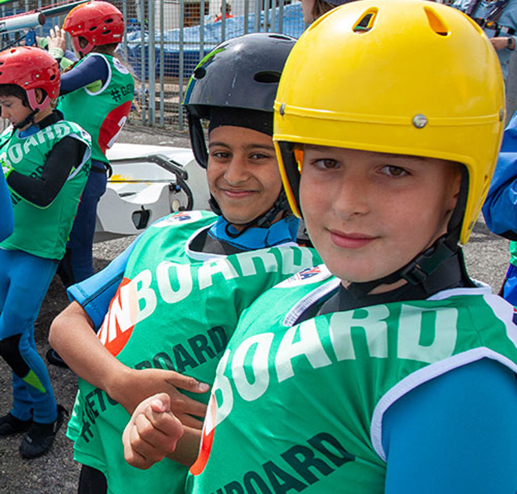 Children wearing sailing helmets 