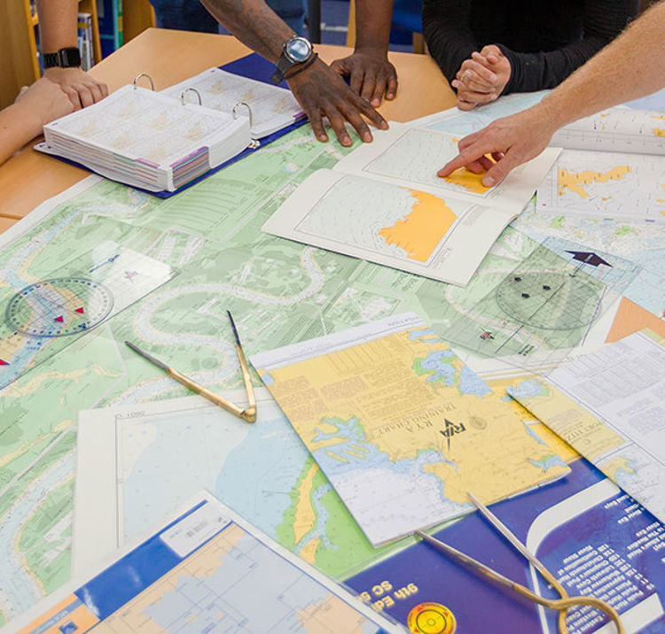 closeup of people looking at charts as part of a training exercise