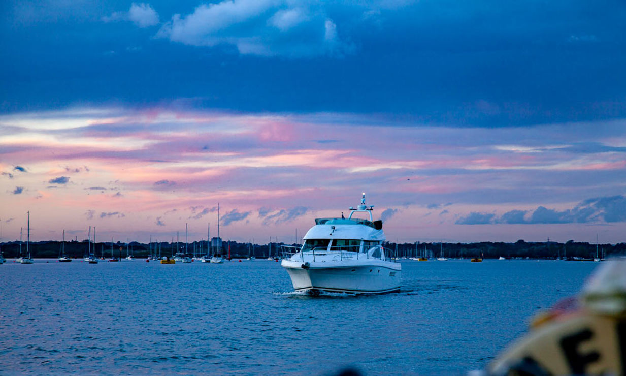 Early evening powerboat sailing as the daylight fades