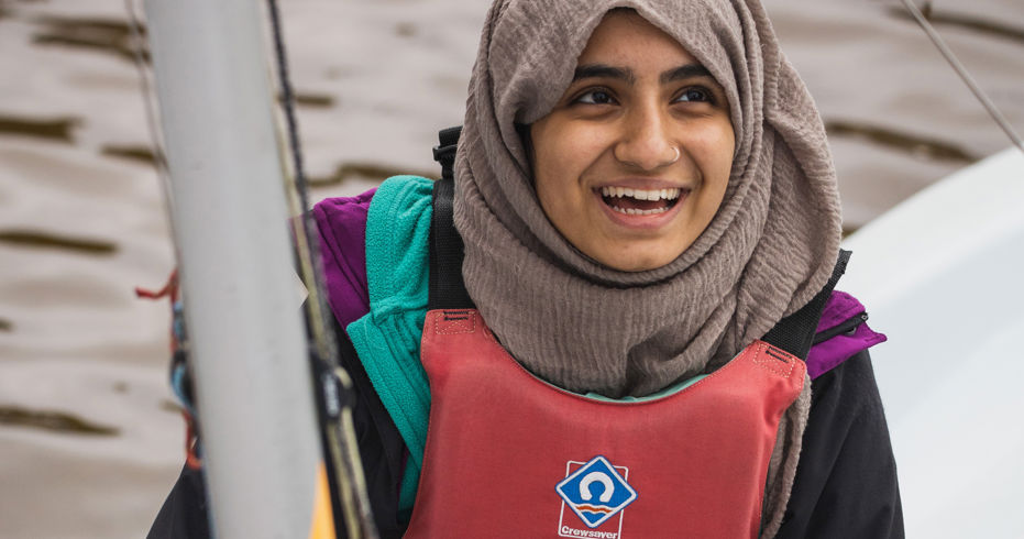 close up head shot of woman on a dinghy