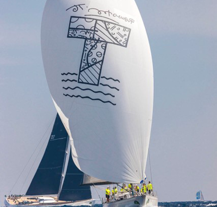 Sail of boat with Young Tigris logo printed on it 